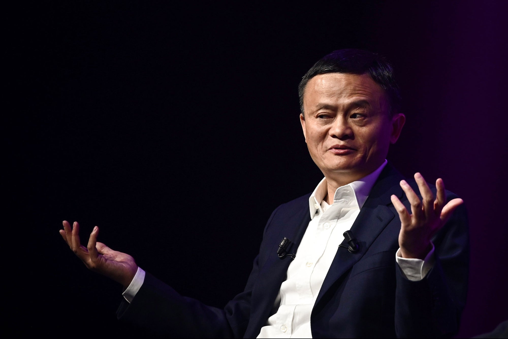 Portrait of Jack Ma, co-founder and former executive chairman of Alibaba Group, captured in a professional setting that highlights his influential role in global e-commerce and business innovation.​