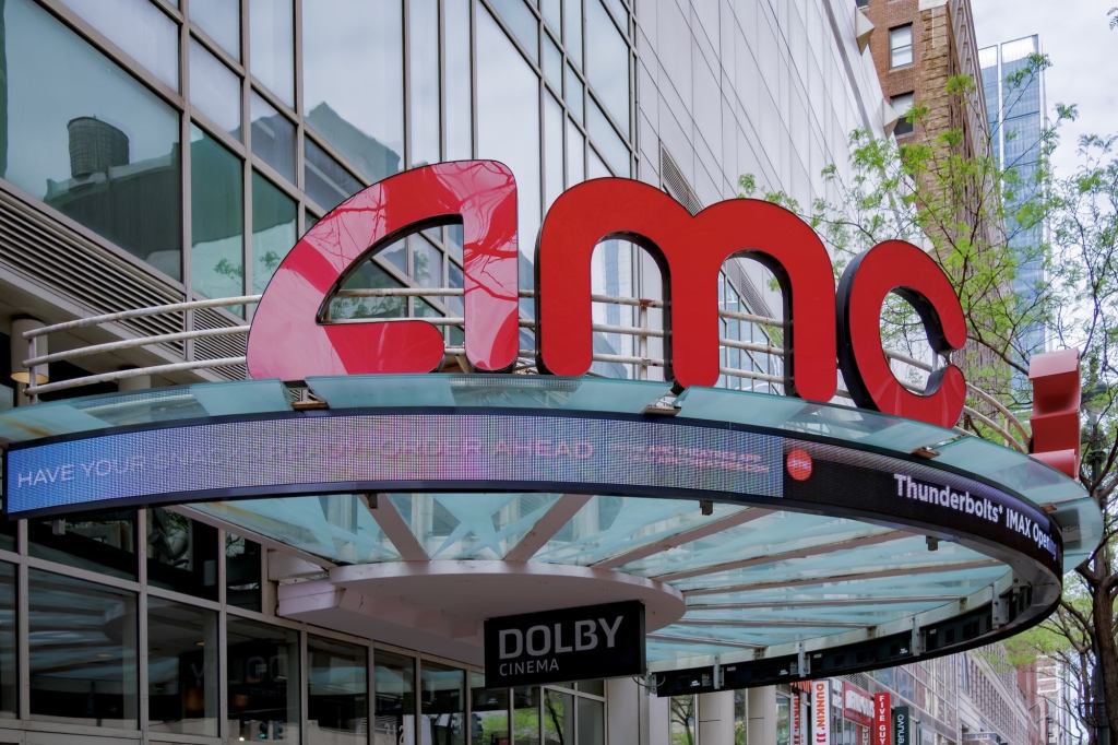 An AMC Theatres marquee and entrance, the chain that now discloses a 25-to-30-minute preshow window on ticket purchases.