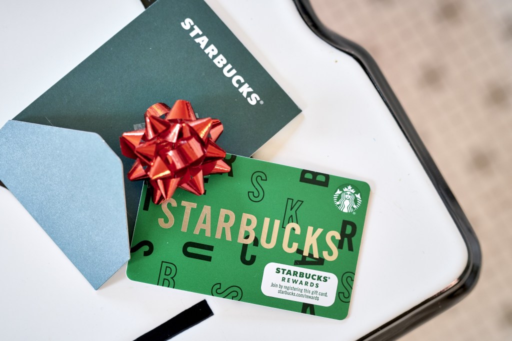 A Starbucks gift card arranged in the Brooklyn Borough of New York, U.S., on Friday, Oct. 15, 2021. An economy hamstrung by all types of global supply-chain snarls and mounting product shortages is making giving gift cards a fail-safe way to ensure there are presents under the Christmas tree. Photographer: Gabby Jones/Bloomberg