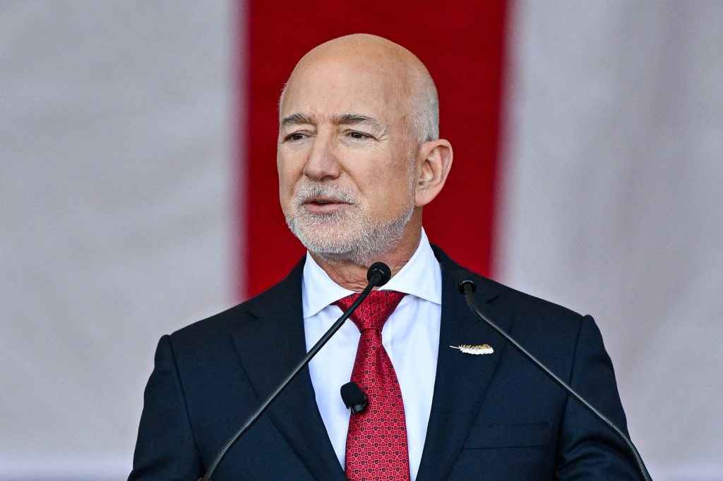 Jeff Bezos speaks onstage ahead of US Defense Secretary Pete Hegseth at Blue Origin in Cape Canaveral, Florida, on February 2, 2026. (Photo by Miguel J. Rodriguez Carrillo / AFP)