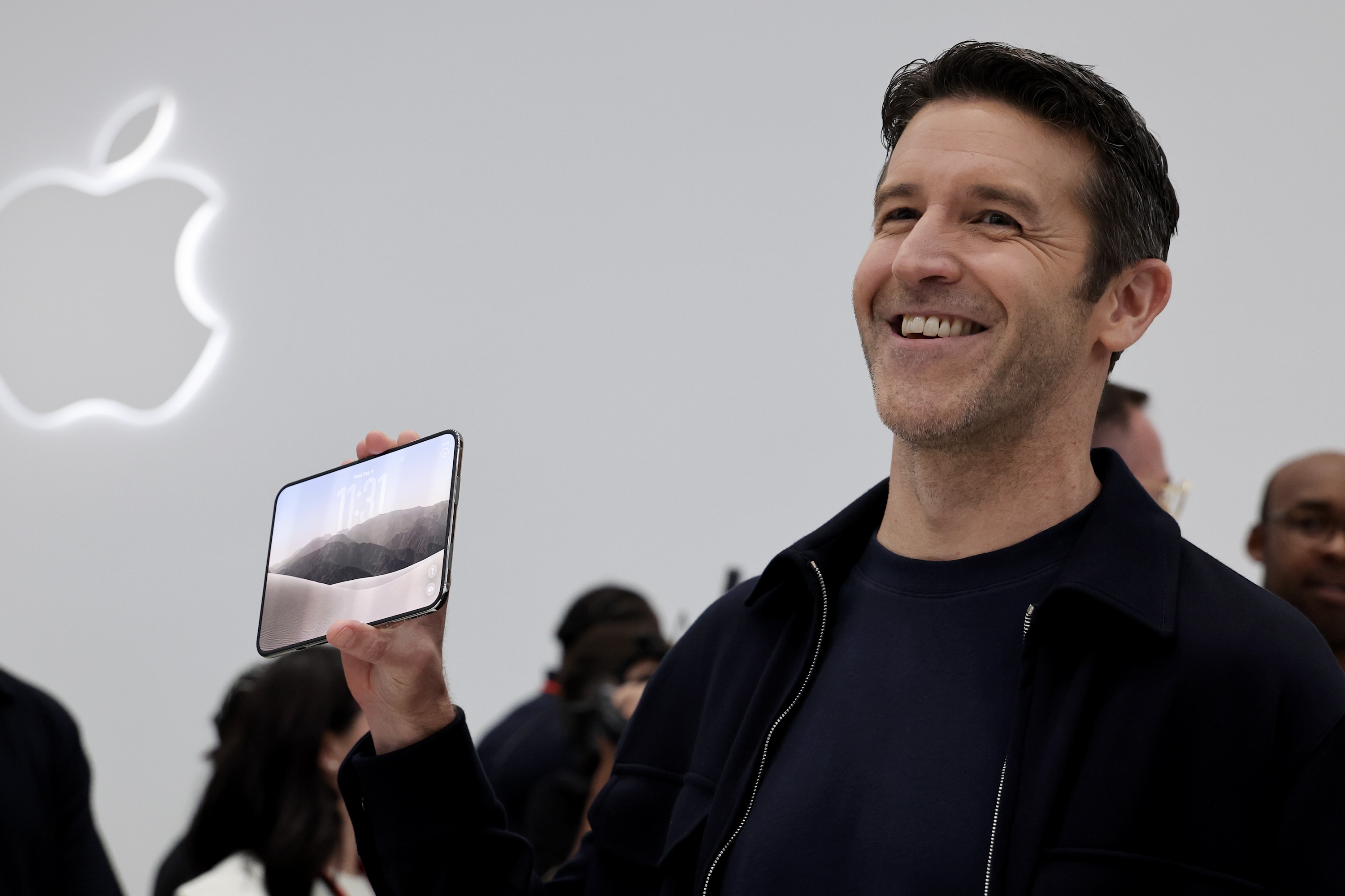 Ternus holds the iPhone Duo. Photo by Benjamin Fanjoy/Getty Images