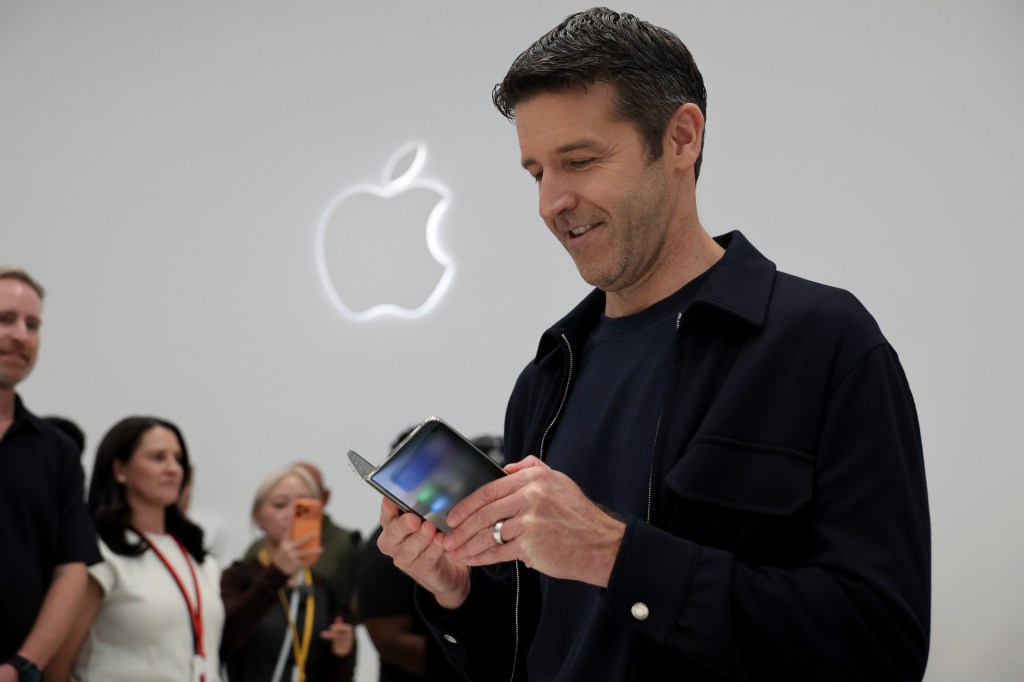 Apple CEO John Ternus holds the iPhone Duo. Photo by Benjamin Fanjoy/Getty Images